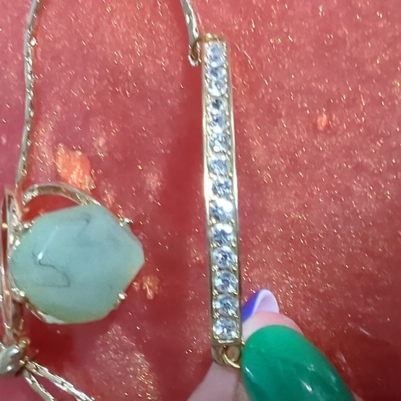 Gold Ring with Green Stone and Bracket - Picture 2 of 3